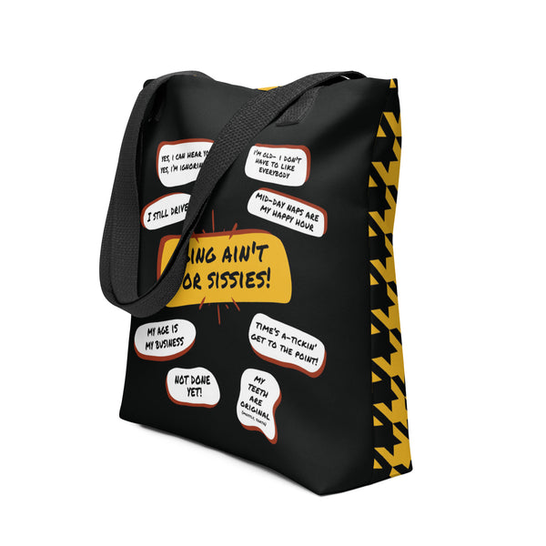 Photo of a two sided tote bag. One side is black with several funny old people bubble quotes, including, Aging Ain't For Sissies, I Still Drive, Not Done Yet, and several more. The reverse side has a black and yellow houndstooth pattern.