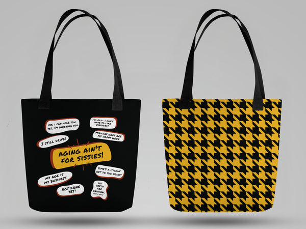 Photo of side by side view of the front and back of a  tote bag. One side is black with several funny old people bubble quotes, including, Aging Ain&#39;t For Sissies  and several more. The reverse side has a black and yellow houndstooth pattern.