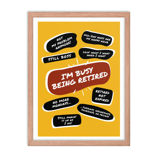 Pictured is a red oak wood framed yellow poster print with a large red quote bubble in the center that says, Im Busy Being Retired. Several more quote bubbles surround it with funny retirement quips.