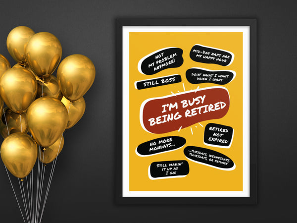 Mounted on a wall next to a bunch of gold balloons is a black wood framed yellow poster print with a large red quote bubble in the center that says, Im Busy Being Retired. Several more quote bubbles surround it with funny retirement quips.